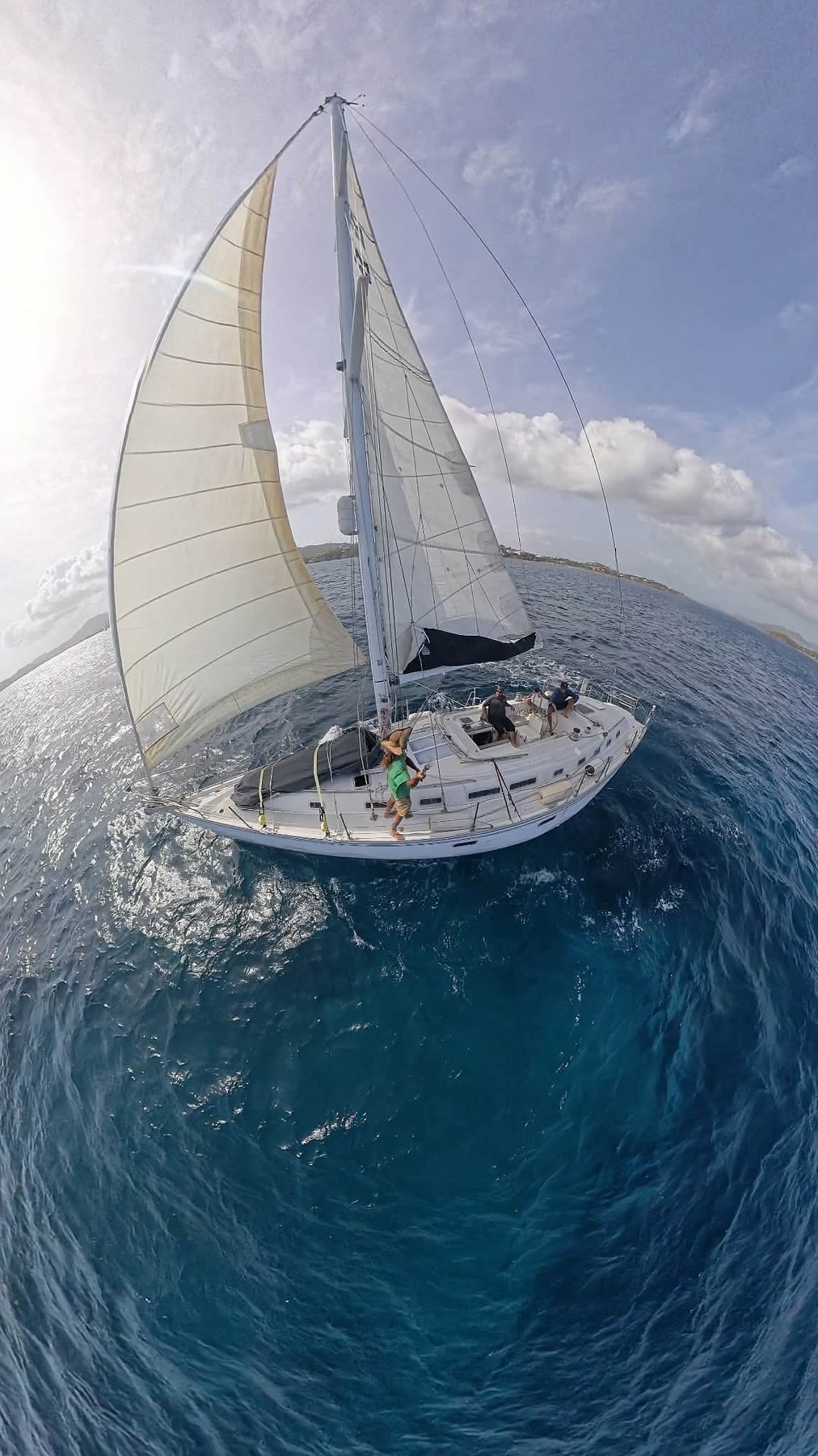 Serenity sailing with both sails open in Caribbean water